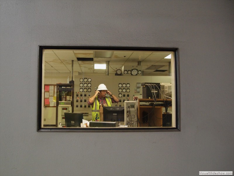 An operator in the boiler/generator control room