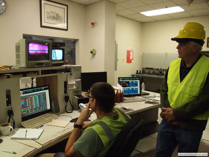 Scotia power plant control room video boiler monitors, with Doug McCorkle to right of the operator